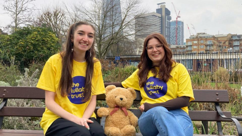 Jodie and Hannah sitting on a bench