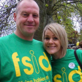 Sue and her husband wearing green FSID t-shirts