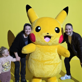 Helen, Gareth and Aerith posing with Pikachu.