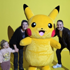 Helen, Gareth and Aerith posing with Pikachu.