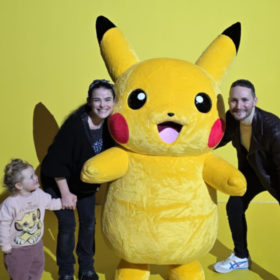 Helen, Gareth and Aerith posing with Pikachu.
