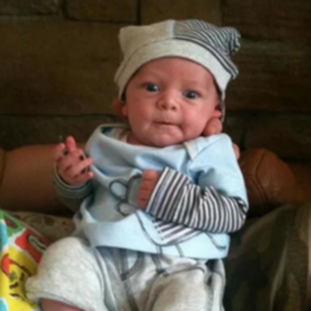 Baby Olli wearing stripy hat