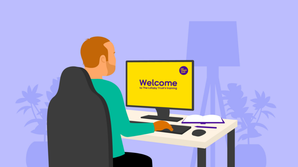 Man sitting at desk doing The Lullaby Trust training
