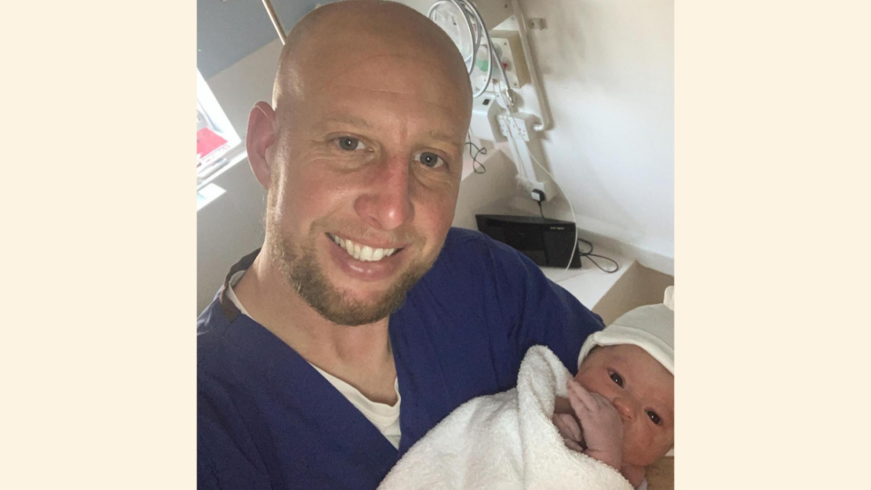 Craig holding Ezrah