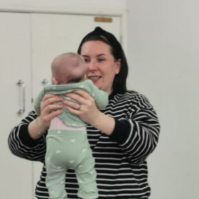 Becky holding her baby.