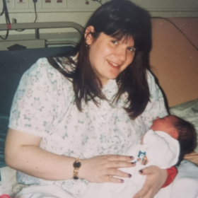 Christine with her daughter, Nerice, sitting up in bed.