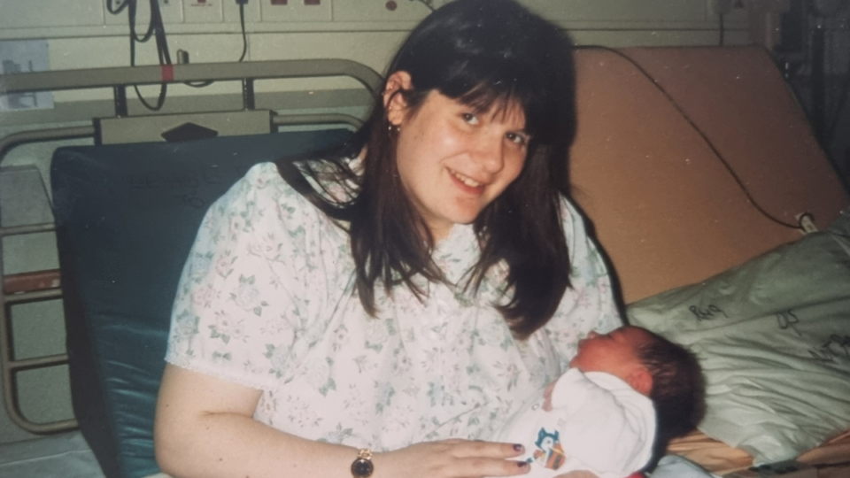 Christine with her daughter, Nerice, sitting up in bed.
