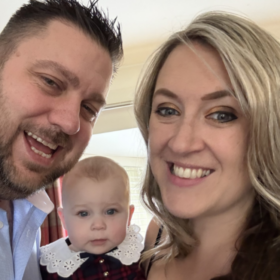 Helen, Faith and Stephen smiling at the camera. Helen has blond hair, and Stephen has brown hair and a beard.