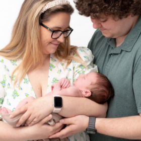 Parent Leanne and Nick holding their baby, Ralph.