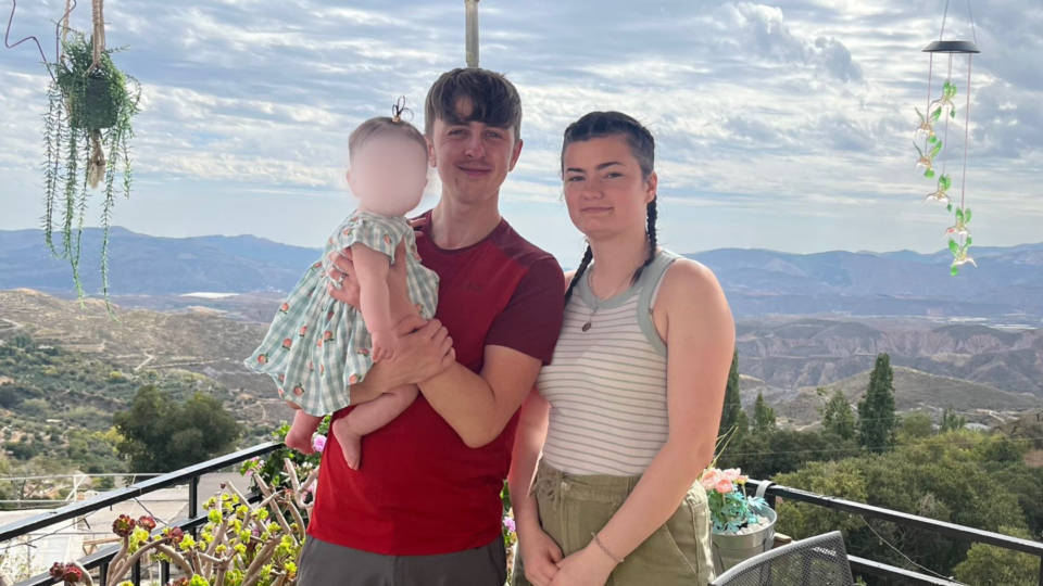 Meg, Ben and Cordelia in Spain, in front of a beautiful view.