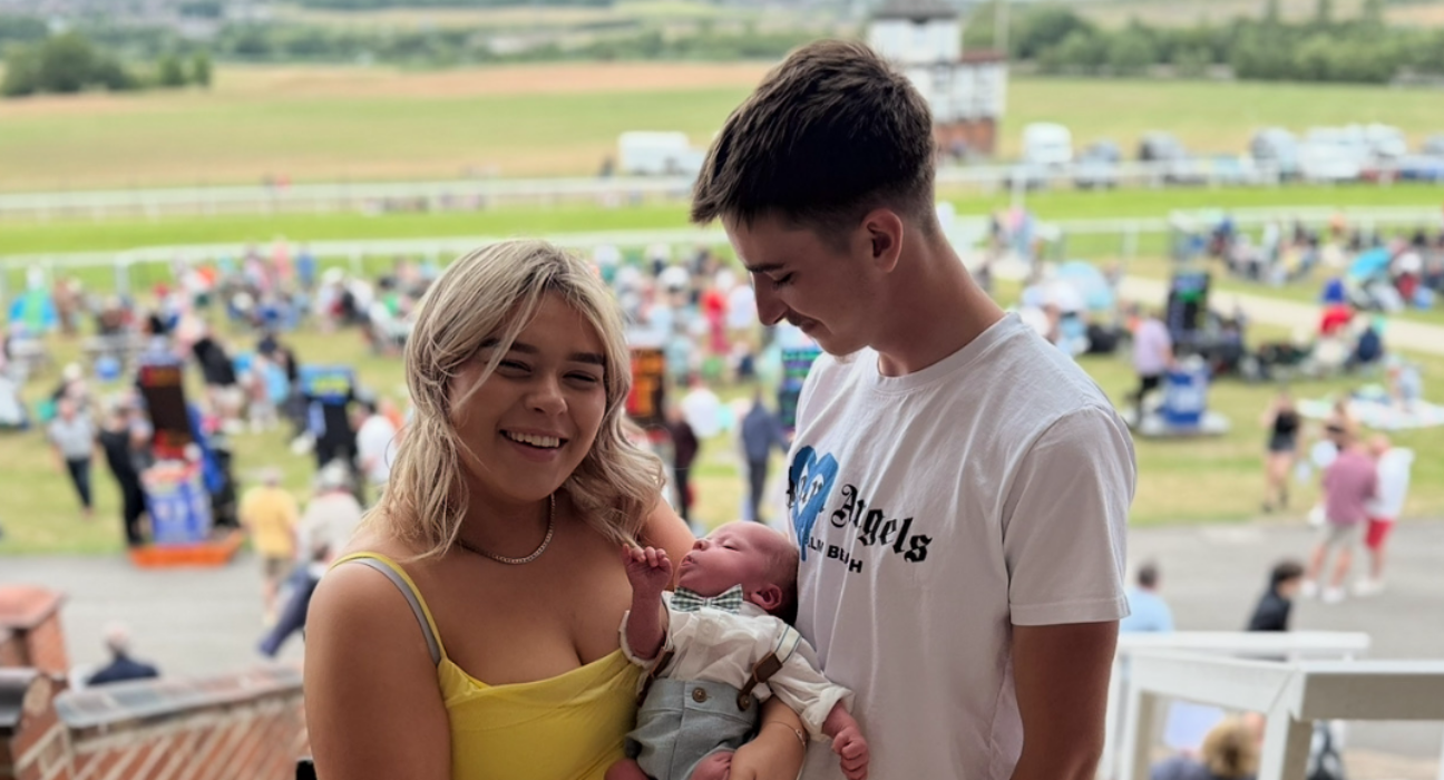 Evie, Harley and Samuel in the audience at an event.