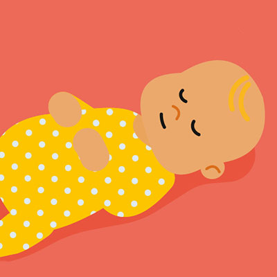 a baby in a yellow and white spotted baby grow sleeps on its back with its hands on its chest